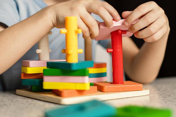 a young child playing with an educational toy