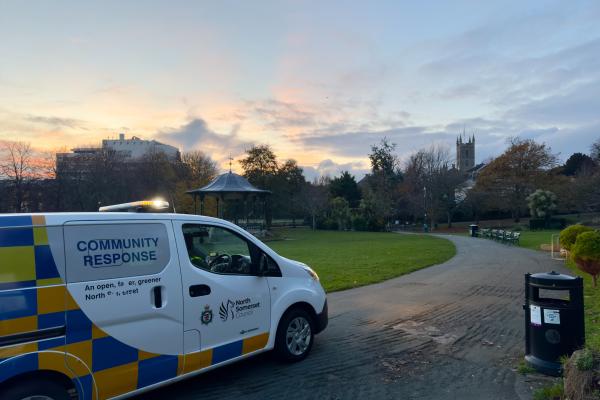 Community response van parked on Grove Park at sunset