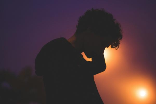 Silhouette of man on the phone